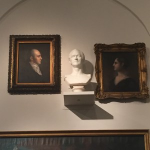 Bust of Alexander Hamilton, flanked by portraits of Aaron and Theodosia Burr, in the New York Historical Society